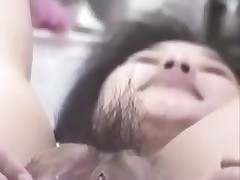 Korean wench with large snatch and pouty lips gets nasty on camera. This babe stuffs her hairy snatch with fingers, metal balls and even a bottle. This cunt can gulp a lot of jizz too!